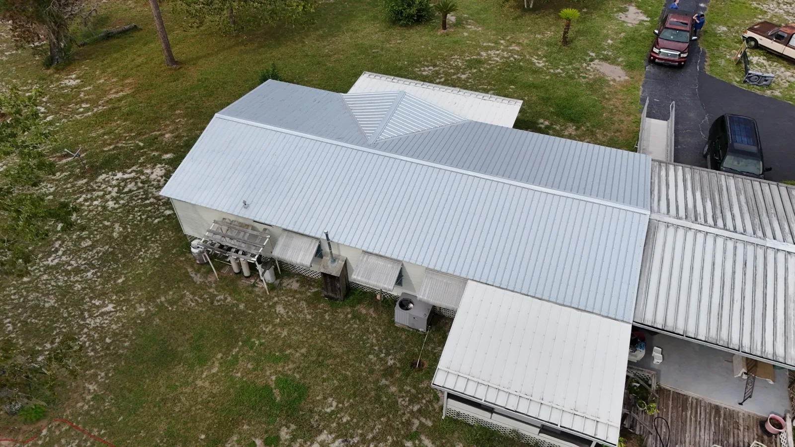 Metal roof and carport on a manufactured home property in Sumter County, FL